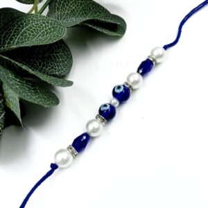 ARNAS 1 PC BLUE ROUND MOTIF EVIL EYE CHARMS DESIGNER RAKHI