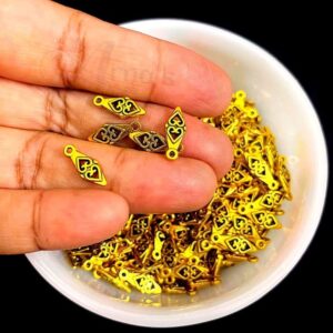 OXIBEADG0006- 50 GM PACK OF GOLDEN DESIGNER MOTIF SMALL GERMAN SILVER METAL BEADS