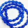 OVALBEADS18- 1 STRAND INDIGO BLUE 14 X 10 MM OVAL BEADS