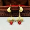 ARNAS 1 PAIR GOLDEN BRASS METAL WITH LOOK ALIKE PEARL DESIGNER MOTIVE EARRINGS