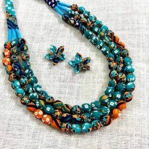 3LDORI52- ARNAS 1 PC PACK OF THREE LAYER FABRIC AND BEADS PRINTED TEAL, RUST ,WHITE AND GOLD TONE  TASSEL WITH 2PCS FABRIC FLOWER
